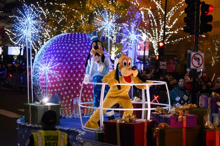 Goofy & Pluto (1)  lights festival on The Magnificent Mile in Chicago, illuminating Michigan Avenue with dazzling displays, festive decorations, and crowds enjoying the lively atmosphere