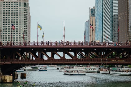 View of The Magnificent Mile, Chicago's renowned shopping district along Michigan Avenue, featuring a variety of stores, dining options, and iconic landmarks. Dining dinner food affordable option on the magnificent mile chicago themagmile the mag mile